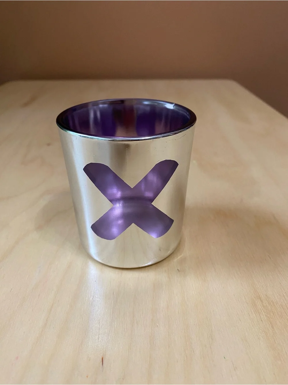 Silver colored glass voltive holder  with Purple Interior and X window